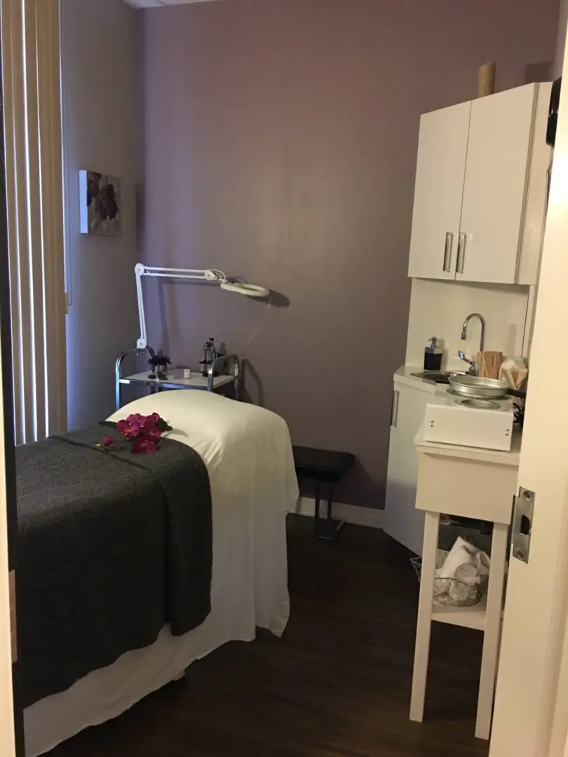 Spa treatment room with massage table.