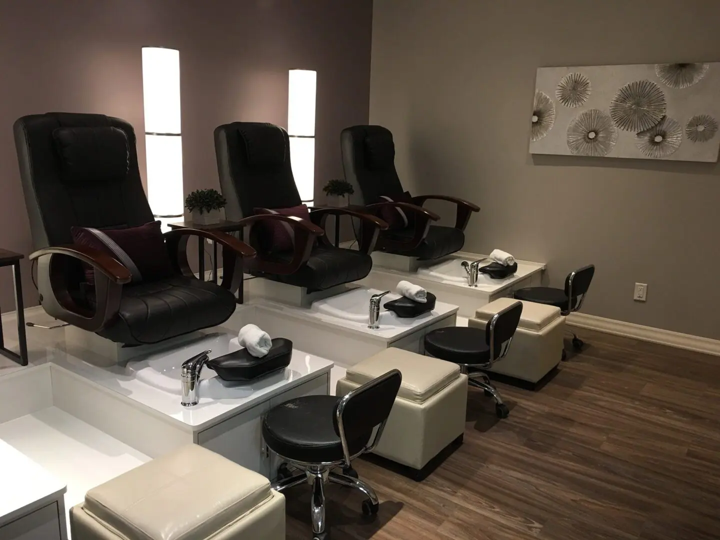 Pedicure chairs in a modern nail salon.