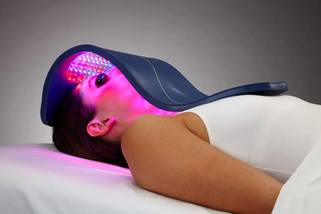 Woman undergoing LED light therapy treatment. Woman undergoing LED light therapy treatment.