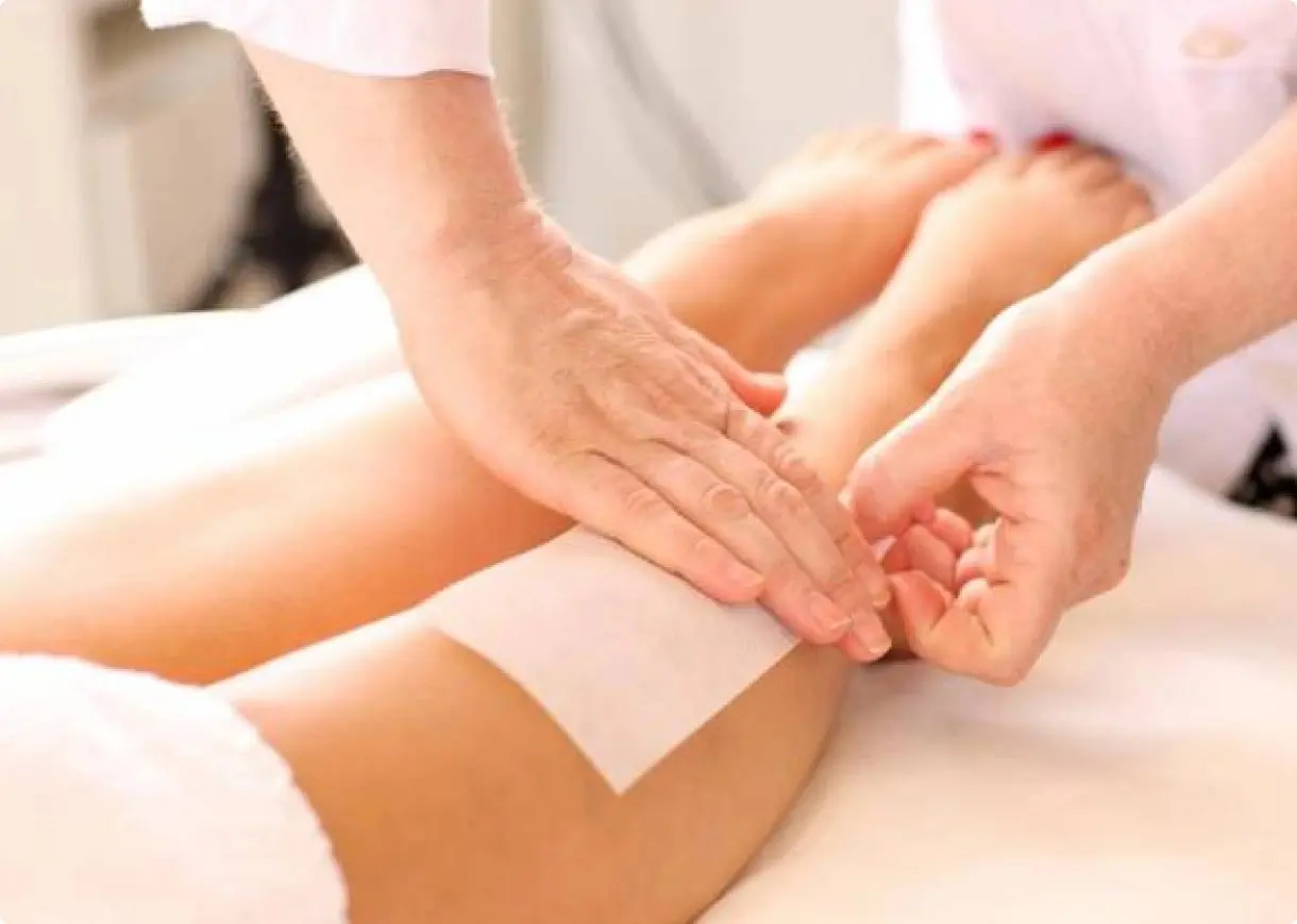 Waxing leg hair removal treatment. Waxing leg hair removal treatment.