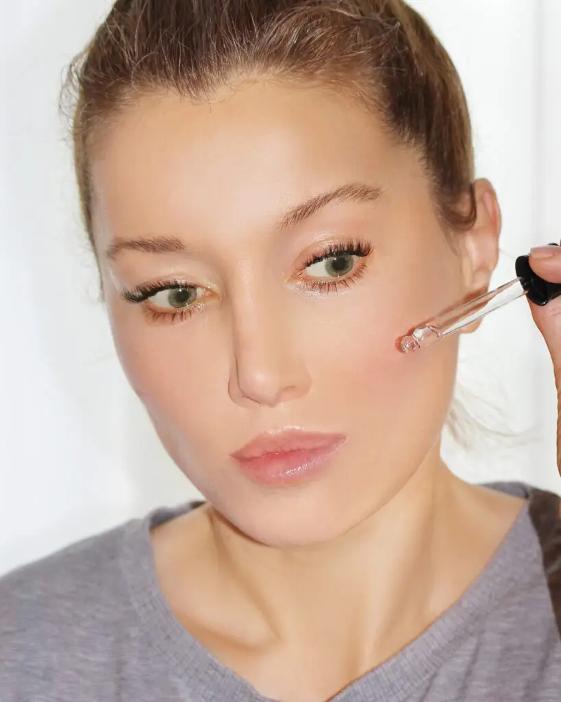 Woman using skincare.