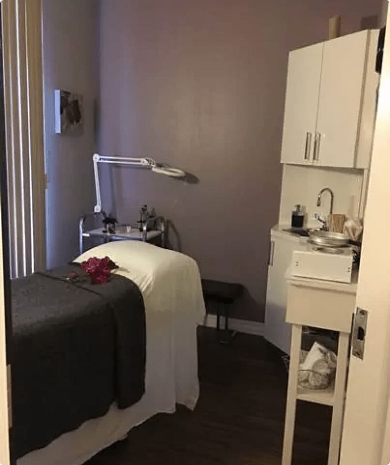 Spa treatment room with massage table.