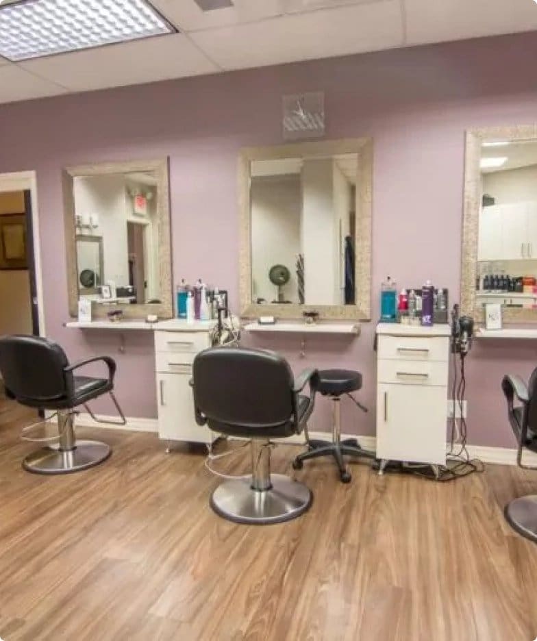 Hair salon with three styling stations.