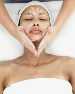 woman receiving facial massage.
